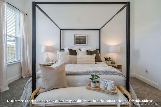 carpeted bedroom featuring baseboards