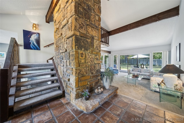 living room featuring beamed ceiling, dark carpet, a textured ceiling, and high vaulted ceiling