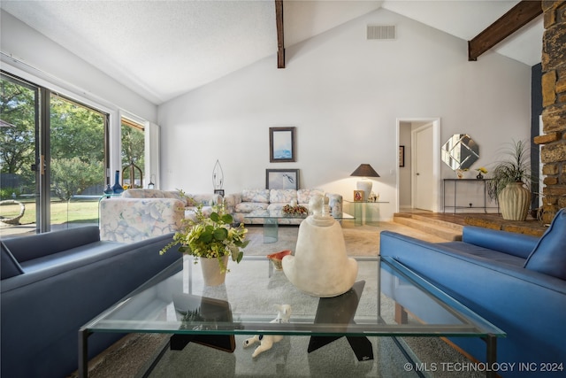 living room featuring beam ceiling, hardwood / wood-style floors, high vaulted ceiling, and a textured ceiling