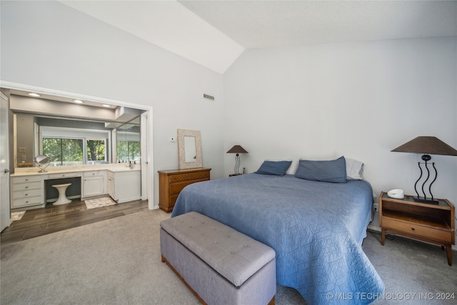 bedroom featuring wood-type flooring and lofted ceiling