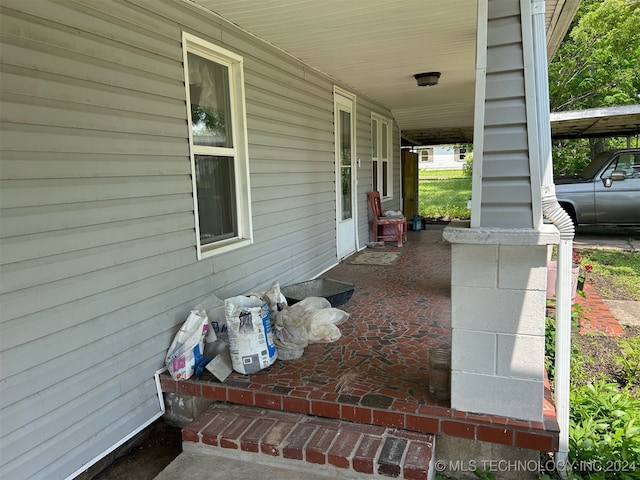 view of patio / terrace featuring a carport