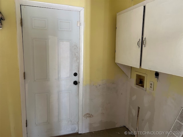 laundry room with washer hookup, cabinets, and hookup for an electric dryer