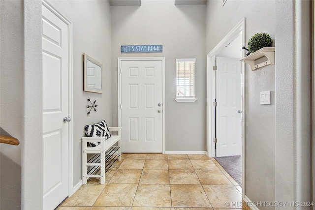 entrance foyer with light tile patterned floors