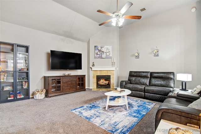 living room with ceiling fan, a fireplace, carpet floors, and lofted ceiling