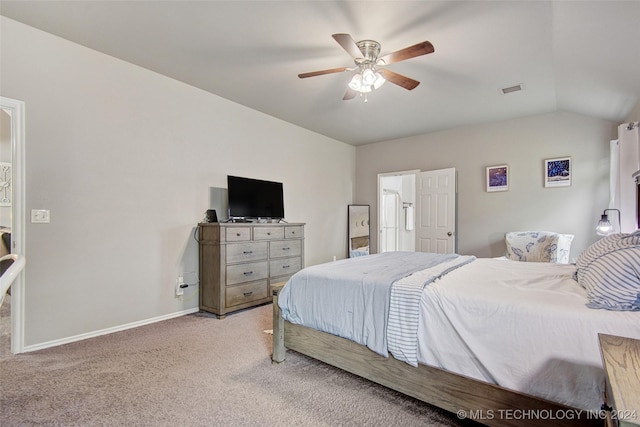 carpeted bedroom with ceiling fan and vaulted ceiling