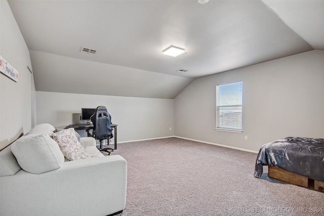 carpeted bedroom with vaulted ceiling