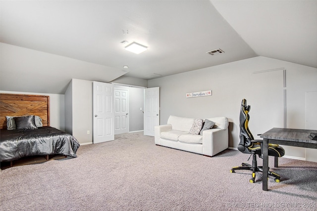 bedroom featuring carpet flooring and vaulted ceiling