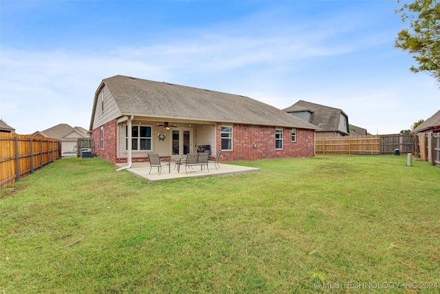 back of house with a lawn, central air condition unit, ceiling fan, and a patio