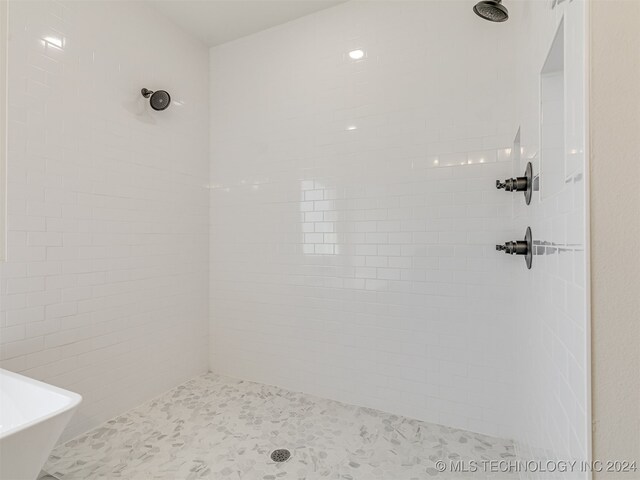 bathroom featuring independent shower and bath and tile patterned flooring