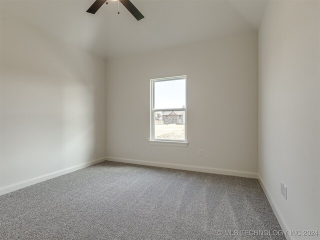 unfurnished room with ceiling fan and carpet flooring