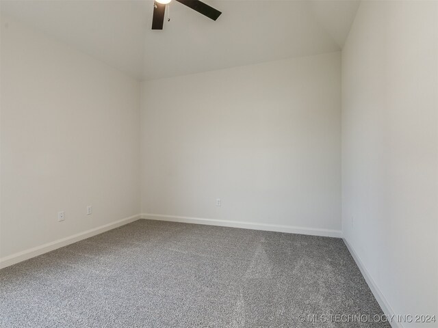 unfurnished room featuring ceiling fan and carpet flooring