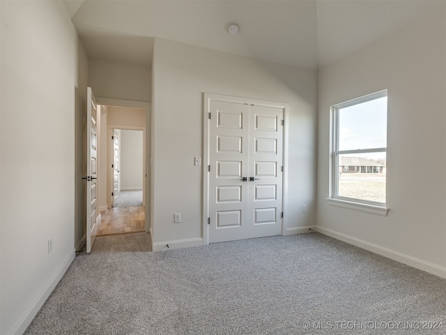 unfurnished bedroom featuring a closet, carpet flooring, and baseboards