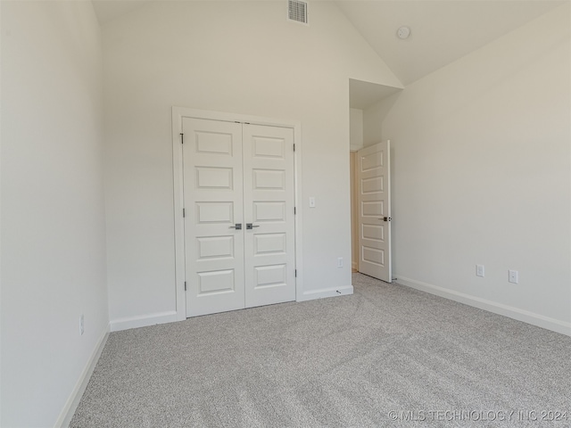 unfurnished bedroom featuring a closet, carpet flooring, visible vents, and baseboards