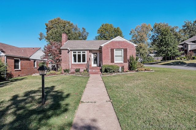 view of front of house with a front yard