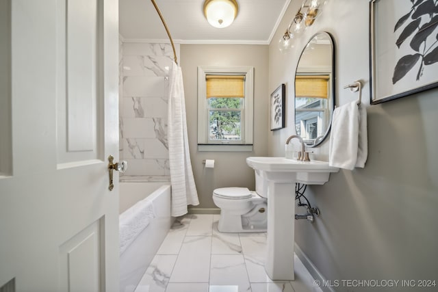 bathroom featuring ornamental molding, shower / bath combo with shower curtain, and toilet