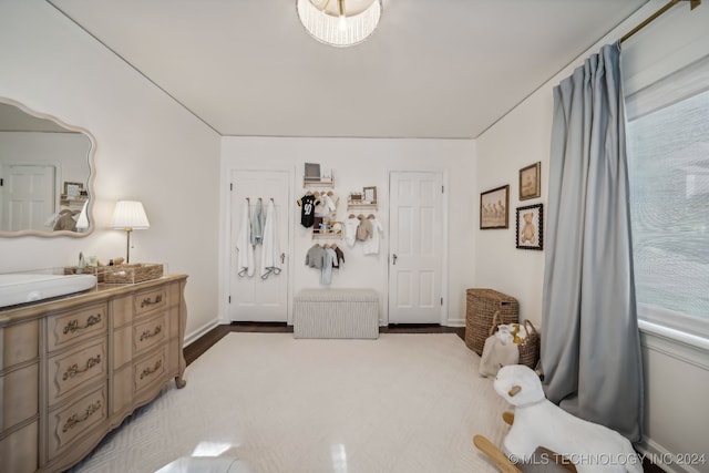 bedroom with hardwood / wood-style flooring