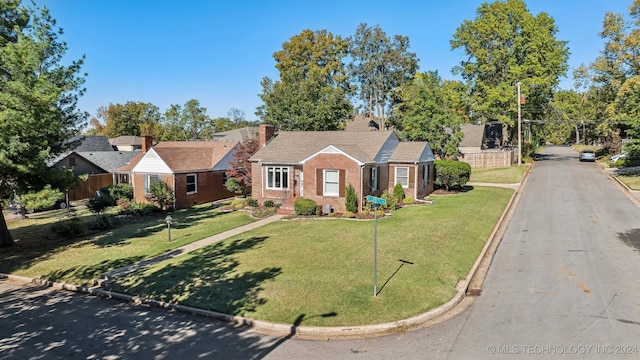 single story home with a front yard