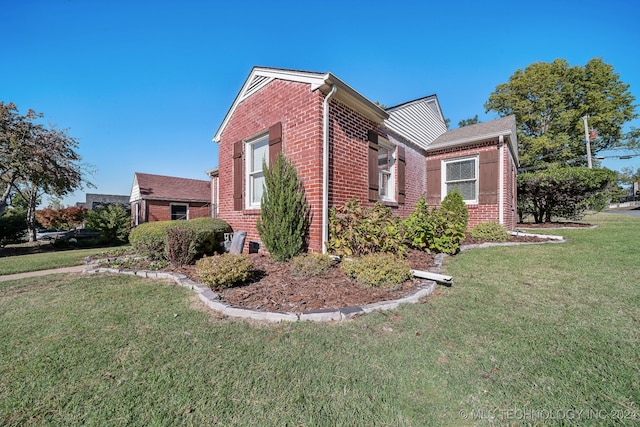 view of property exterior with a yard