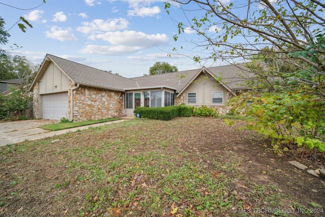 single story home featuring a garage