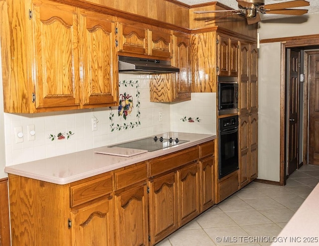 kitchen featuring black appliances, under cabinet range hood, a ceiling fan, and decorative backsplash