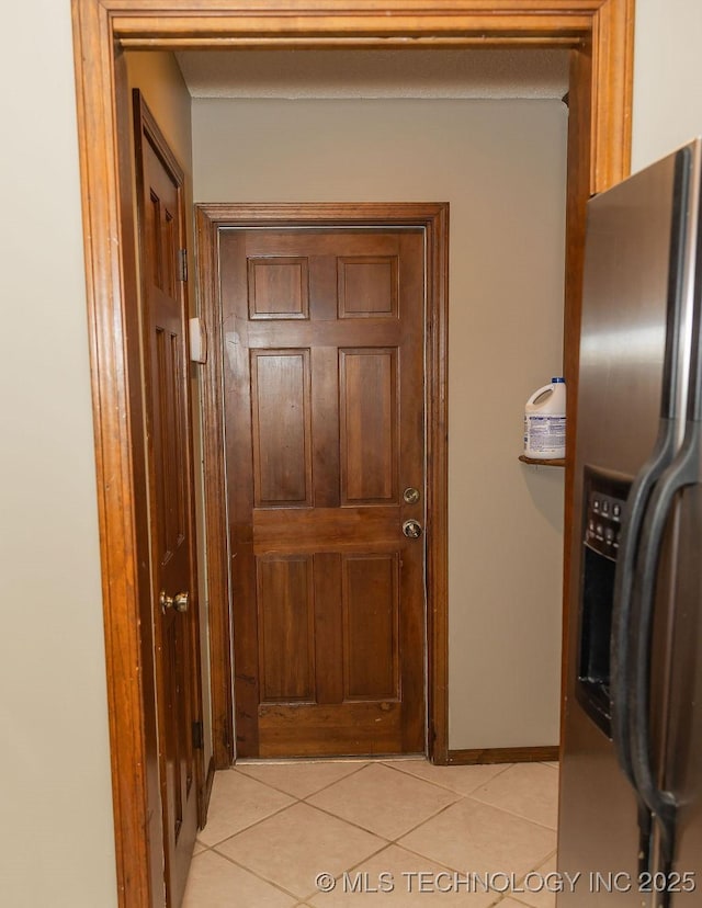 hall with light tile patterned flooring