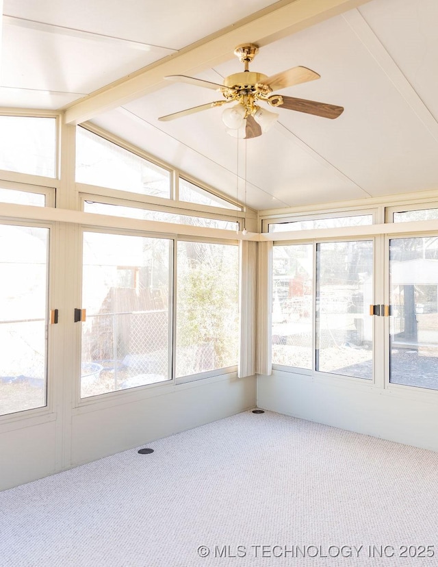unfurnished sunroom with carpet floors and lofted ceiling