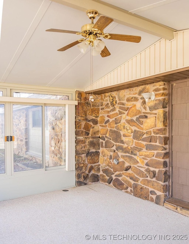 empty room with carpet floors and a ceiling fan