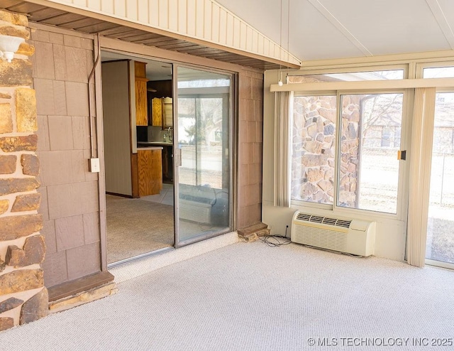 unfurnished sunroom featuring a wall mounted air conditioner