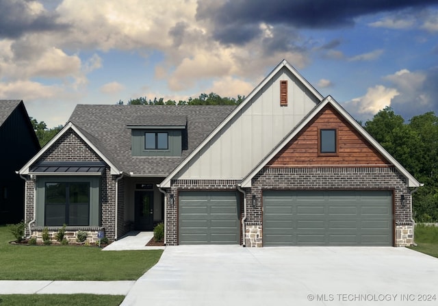 craftsman house with a front lawn and a garage