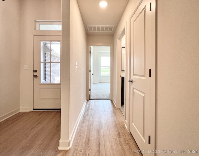 corridor featuring light wood-type flooring