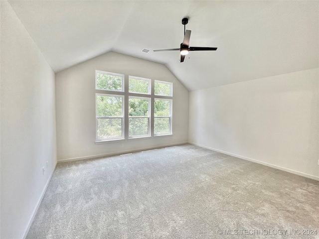 bonus room with lofted ceiling, light colored carpet, and ceiling fan