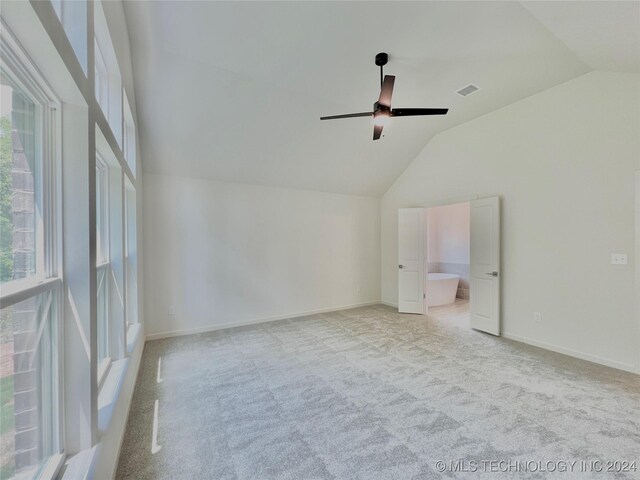 additional living space featuring ceiling fan, light carpet, and lofted ceiling