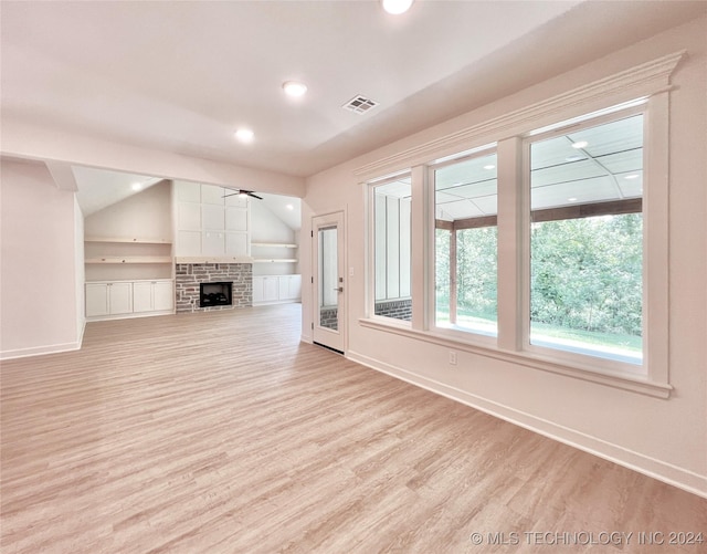 unfurnished living room with vaulted ceiling, ceiling fan, and light hardwood / wood-style floors