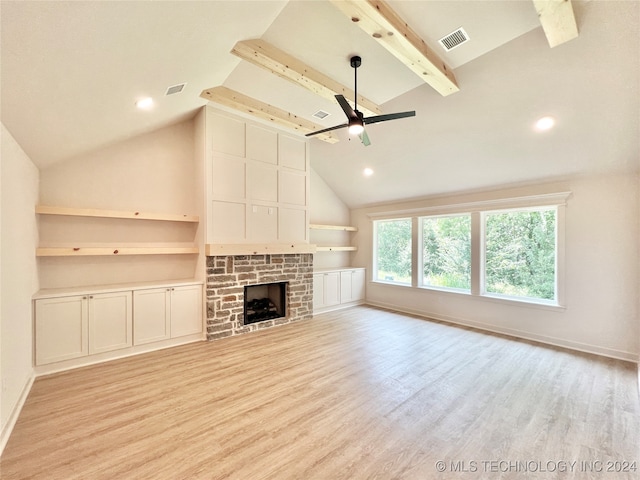 unfurnished living room with a stone fireplace, high vaulted ceiling, light hardwood / wood-style floors, and ceiling fan