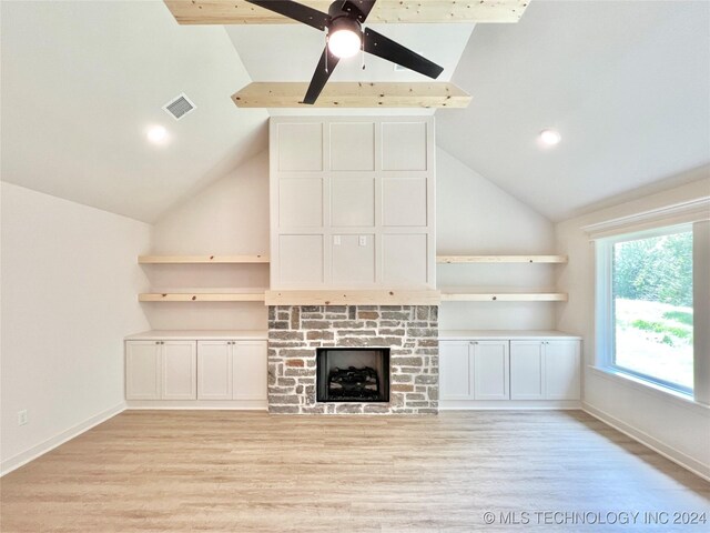 unfurnished living room with light wood-type flooring and lofted ceiling