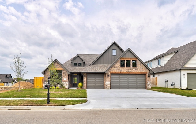 craftsman house with concrete driveway, a front lawn, stone siding, board and batten siding, and a garage