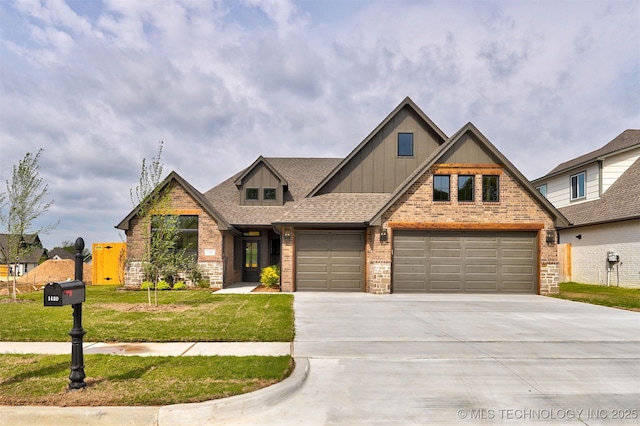 craftsman inspired home with a front lawn, concrete driveway, board and batten siding, an attached garage, and brick siding