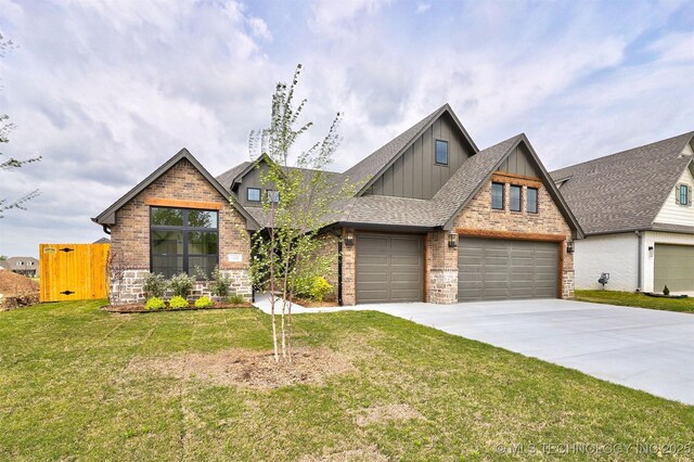 craftsman inspired home featuring a front lawn, driveway, board and batten siding, brick siding, and roof with shingles