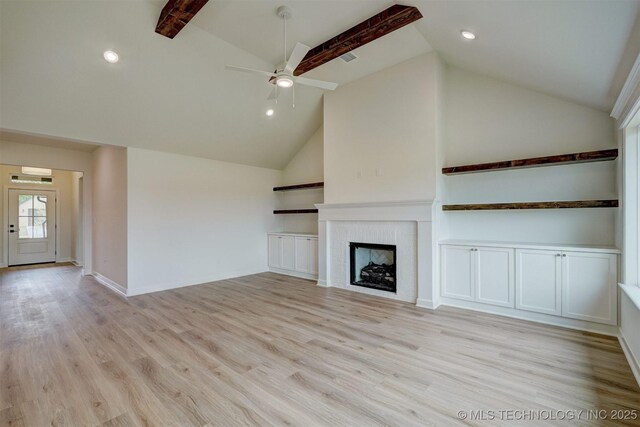 unfurnished living room featuring recessed lighting, light wood-style floors, ceiling fan, a tile fireplace, and high vaulted ceiling