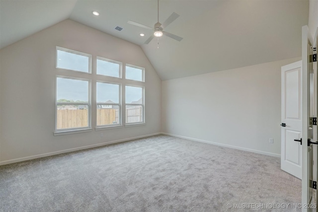 additional living space featuring vaulted ceiling, carpet, and ceiling fan