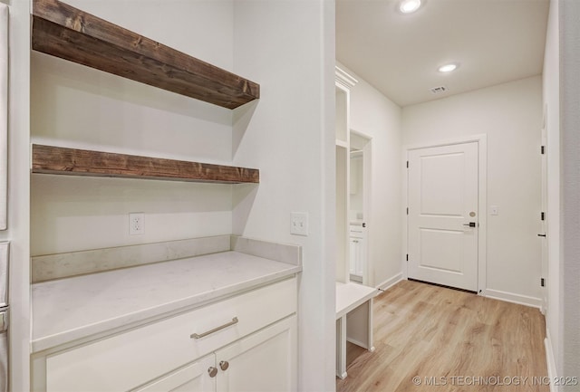 mudroom with recessed lighting, light wood-type flooring, and visible vents