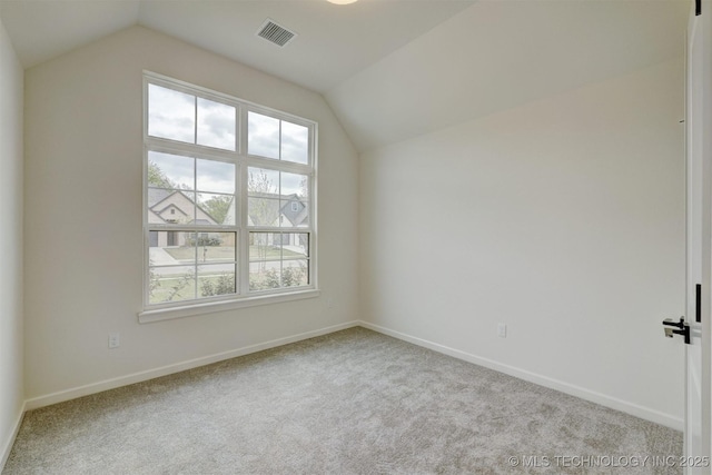 additional living space with vaulted ceiling, visible vents, carpet flooring, and baseboards