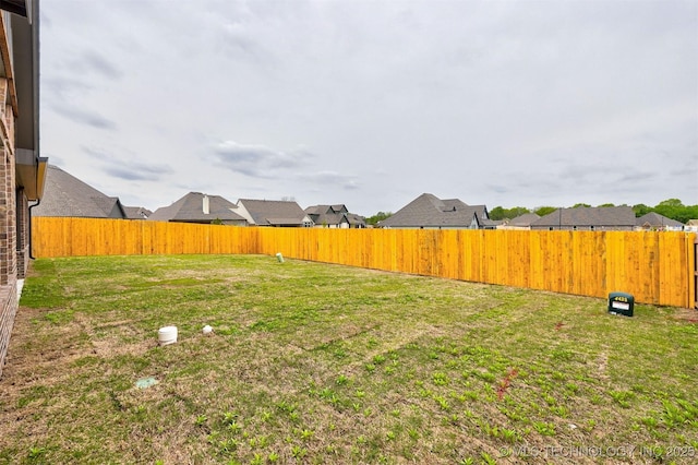 view of yard featuring a fenced backyard