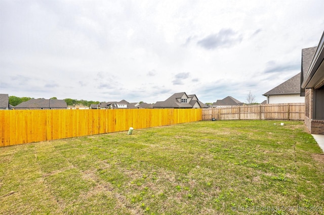 view of yard featuring a fenced backyard