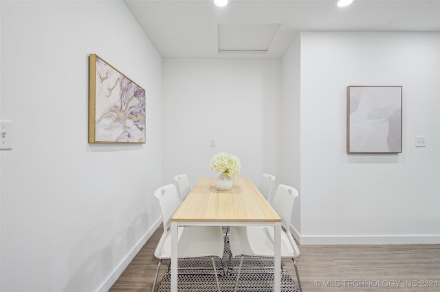 dining space featuring hardwood / wood-style floors