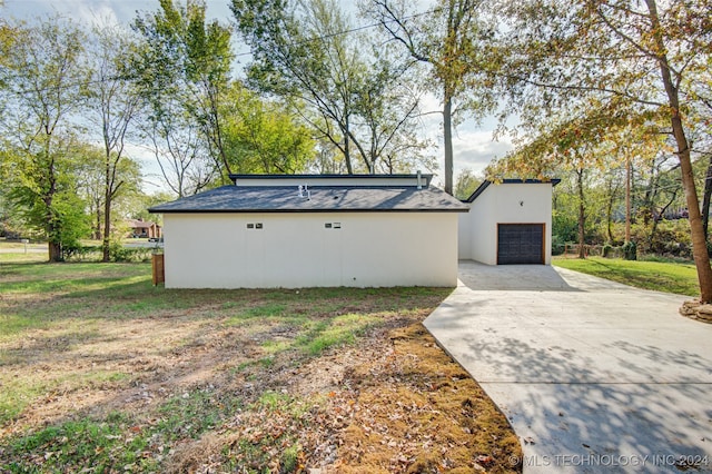 view of side of home with a lawn