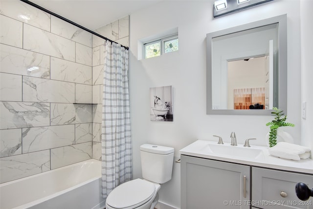 full bathroom with vanity, toilet, and shower / bathtub combination with curtain