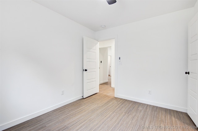 unfurnished room with light hardwood / wood-style floors