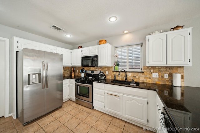 kitchen featuring white cabinets, a healthy amount of sunlight, and appliances with stainless steel finishes