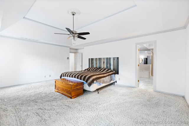 bedroom featuring ensuite bathroom, ceiling fan, carpet flooring, and ornamental molding